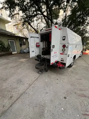 Magnet Plumbing service vehicle on-site for Grease Trap Cleaning in Myrtle Island